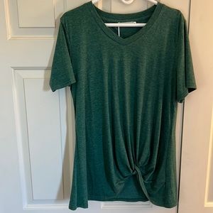 Ladies green v neck long T with gathering at the bottom.